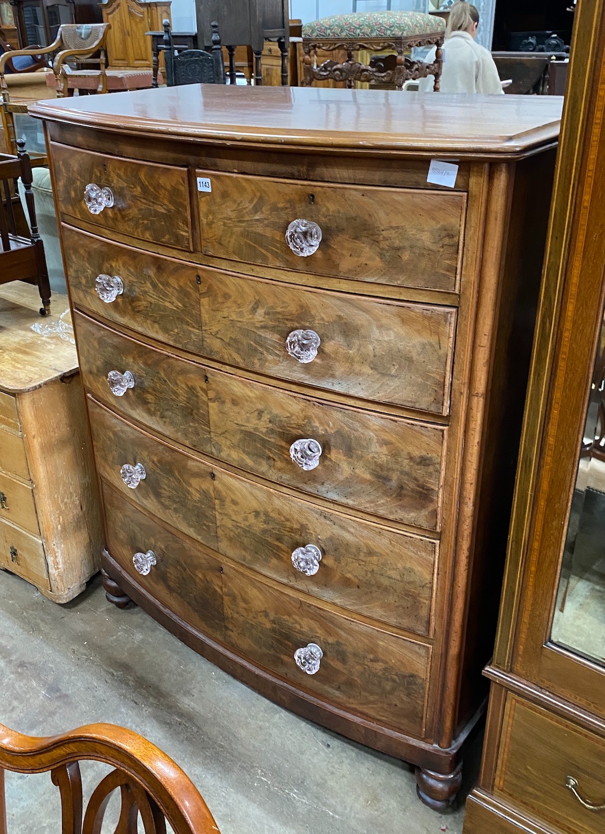 A Victorian mahogany bowfront chest with moulded glass handles, width 114cm, depth 60cm, height 141cm